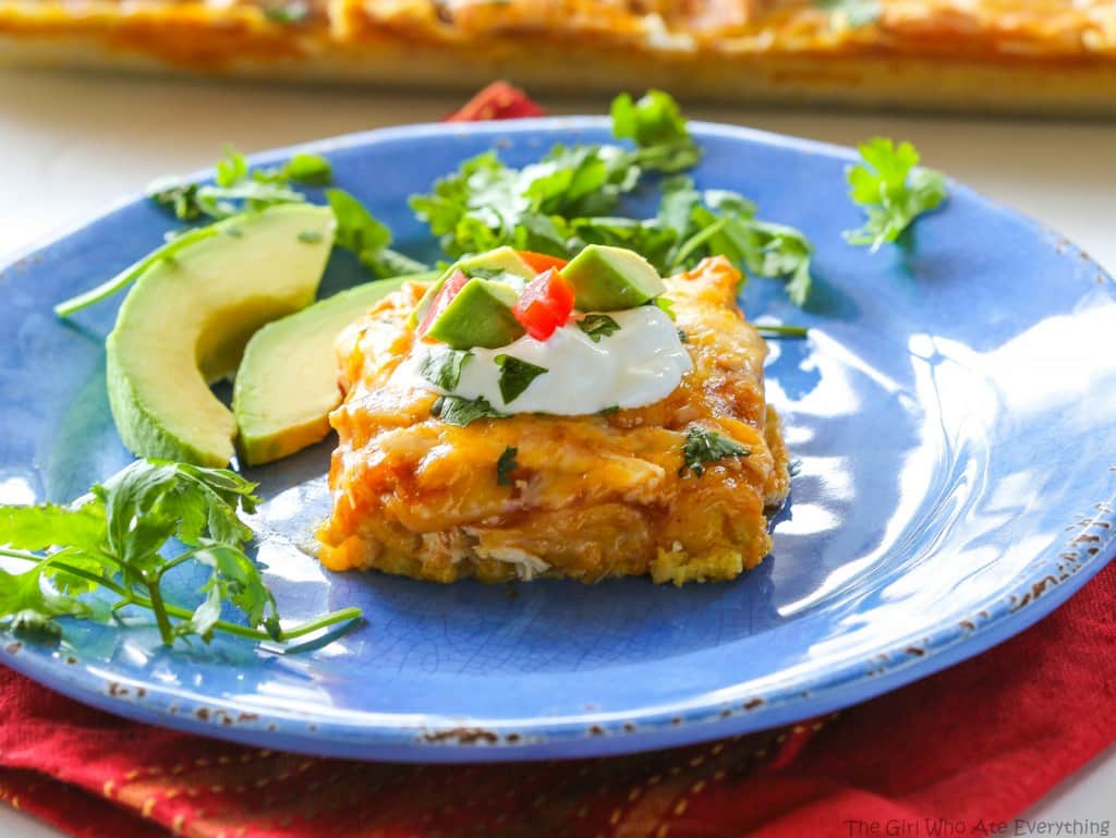 Chicken Tamale Casserole - a sweet cornbread crust topped with enchilada sauce and chicken. This is a crowd pleaser! the-girl-who-ate-everything.com