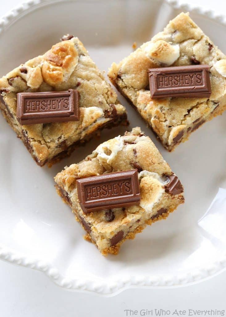 S'mores Cookie Bars - chocolate chip marshmallow cookie dough with a graham cracker crust. Seriously delicious. the-girl-who-ate-everything.com