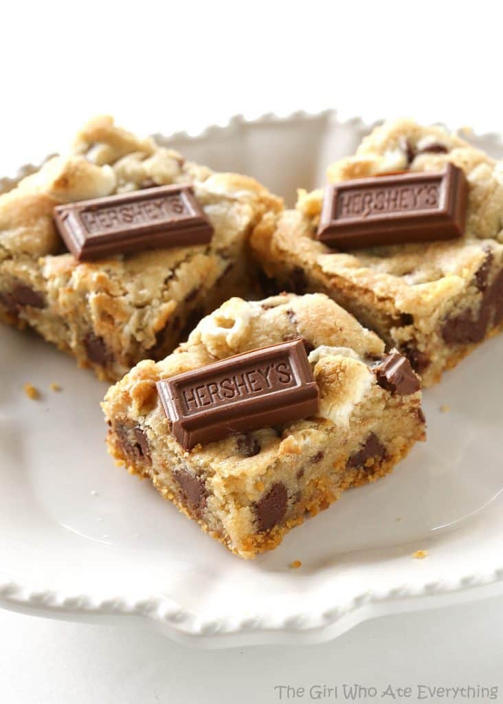 S'mores Cookie Bars - chocolate chip marshmallow cookie dough with a graham cracker crust. Seriously delicious. the-girl-who-ate-everything.com