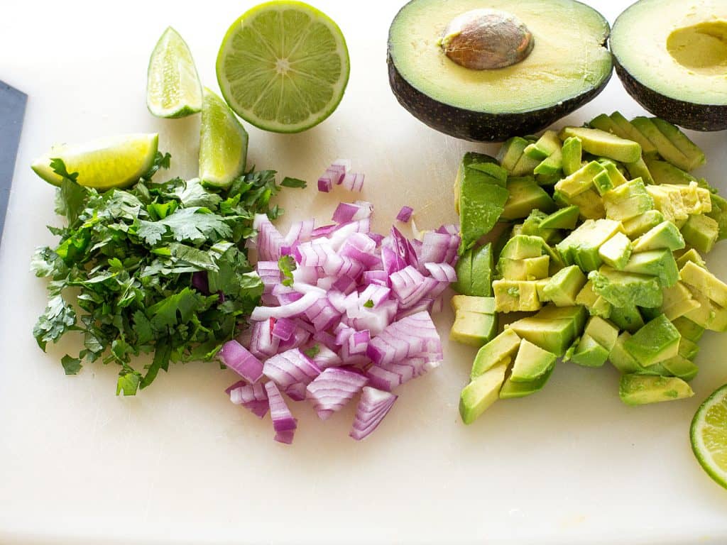 These Grilled Shrimp Tacos with Avocado Salsa are light and refreshing! the-girl-who-ate-everything.com