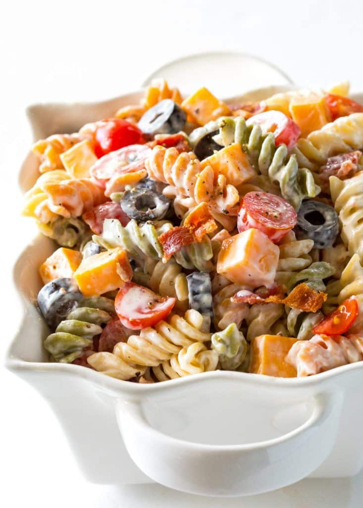 Bacon Ranch Pasta Salad - flavorful pasta salad with cheddar cheese, olives, tomatoes, and bacon. Covered in a creamy ranch sauce. the-girl-who-ate-everything.com