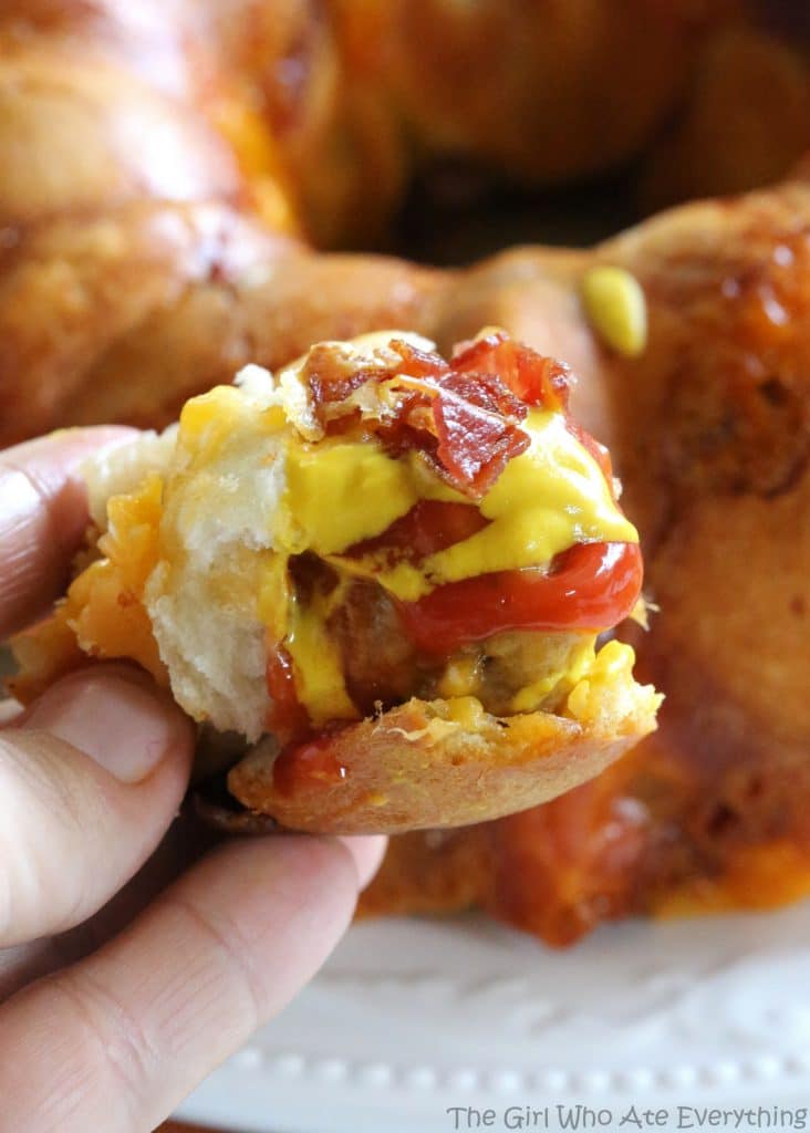 Bacon Cheeseburger Monkey Bread - layers of cheese, bacon, meatballs, and dough. the-girl-who-ate-everything.com