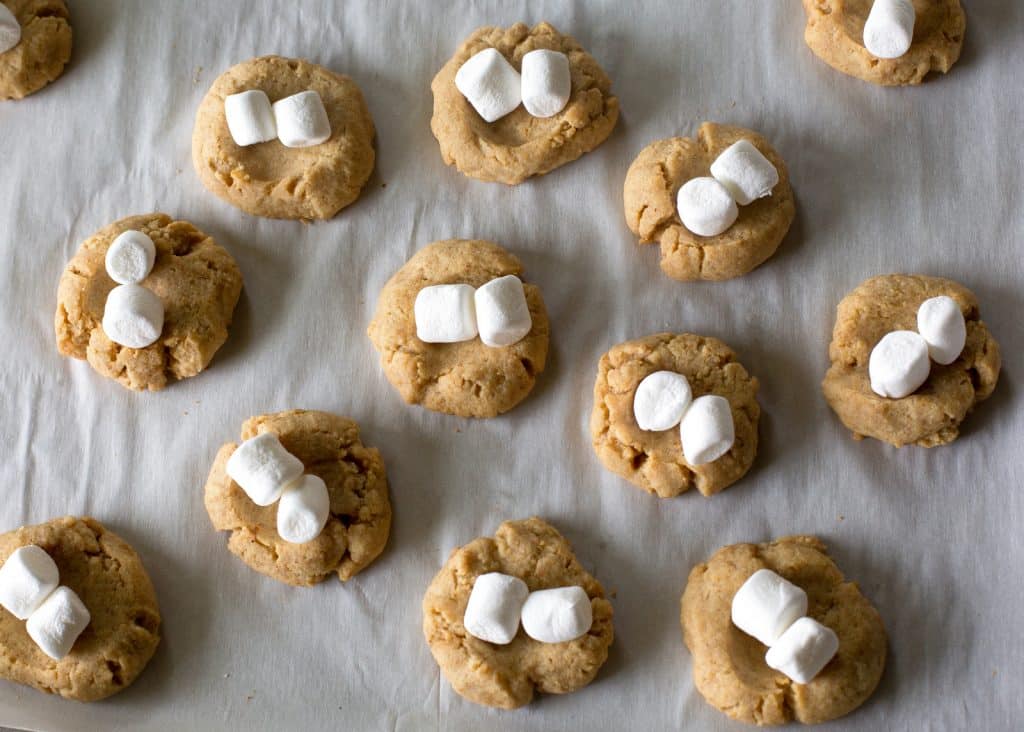 S'mores Thumbprints - a small graham cracker cookie topped with marshmallows and chocolate. the-girl-who-ate-everything.com