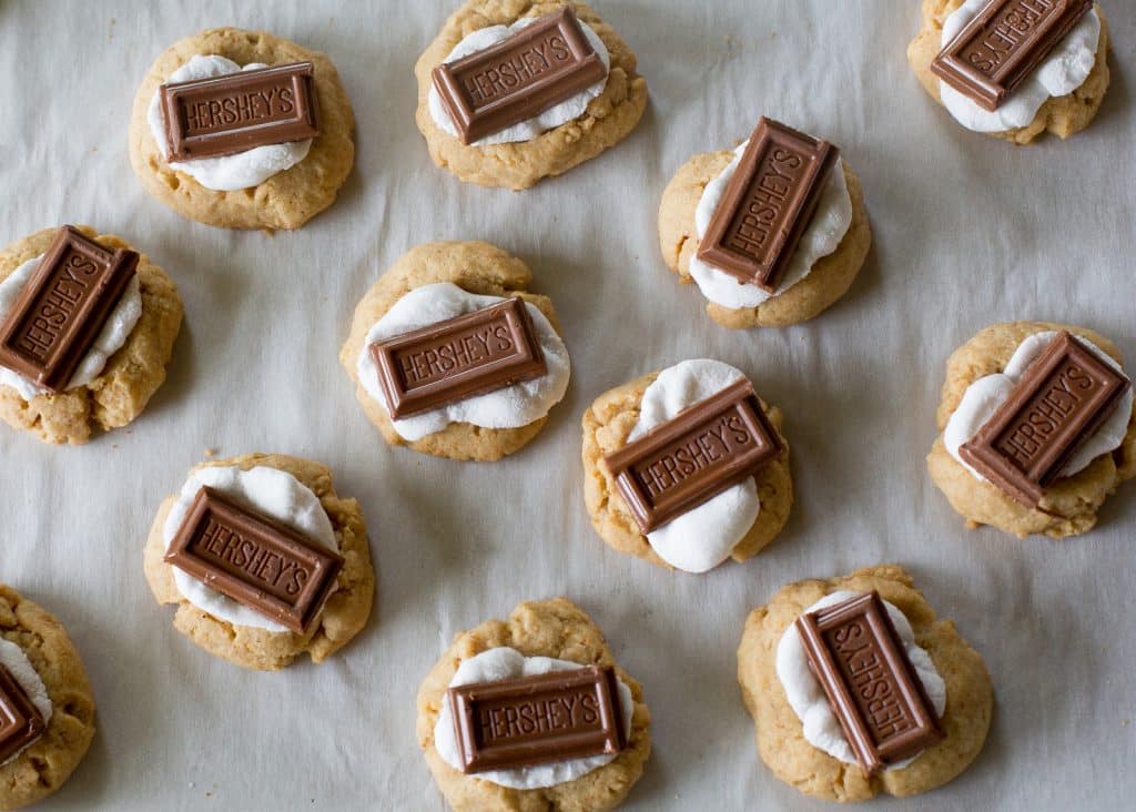 S'mores Thumbprints - a small graham cracker cookie topped with marshmallows and chocolate. the-girl-who-ate-everything.com
