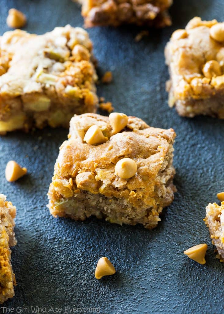 Apple Snack Squares - a dense apple and walnut square that is topped with butterscotch chips. the-girl-who-ate-everything.com