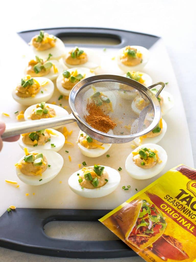 These Mexican Deviled Eggs are a spicy twist on your classic deviled eggs. the-girl-who-ate-everything.com