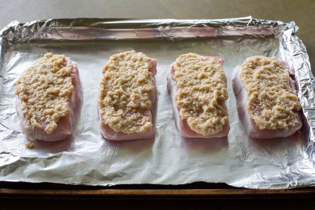 Horseradish Crusted Pork Chops - pork chops topped with a tangy, buttery, breadcrumb topping. the-girl-who-ate-everything.com