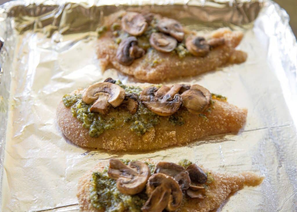 Pesto Chicken - you'll never believe how easy this delicious dinner is! the-girl-who-ate-everything.com