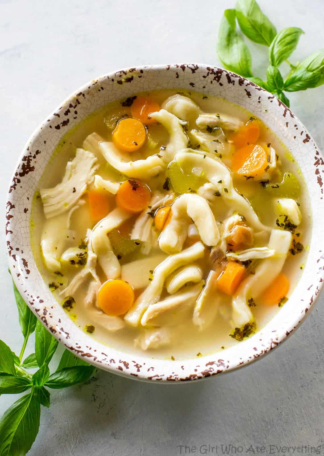 Homemade Chicken Noodle Soup - tried and true comfort food. A recipe for homemade noodles too but you can use store bought as well. the-girl-who-ate-everything.com