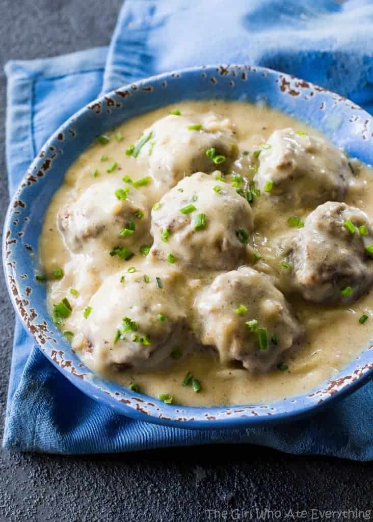 Swedish Meatballs - so tender with a flavorful gravy. Serve over noodles or rice. the-girl-who-ate-everything.com