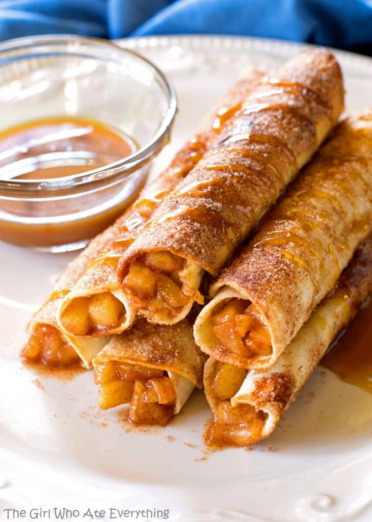Creamy Caramel Apple Taquitos - filled with cinnamon apples, caramel, and cream cheese, rolled in cinnamon sugar and drizzled with caramel. the-girl-who-ate-everything.com