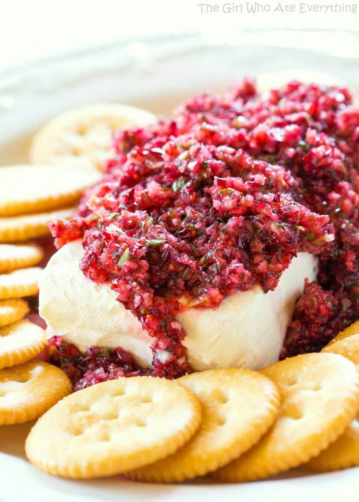 Fresh Cranberry Salsa served over cream cheese - this spicy and sweet combo is always a hit at parties. the-girl-who-ate-everything.com