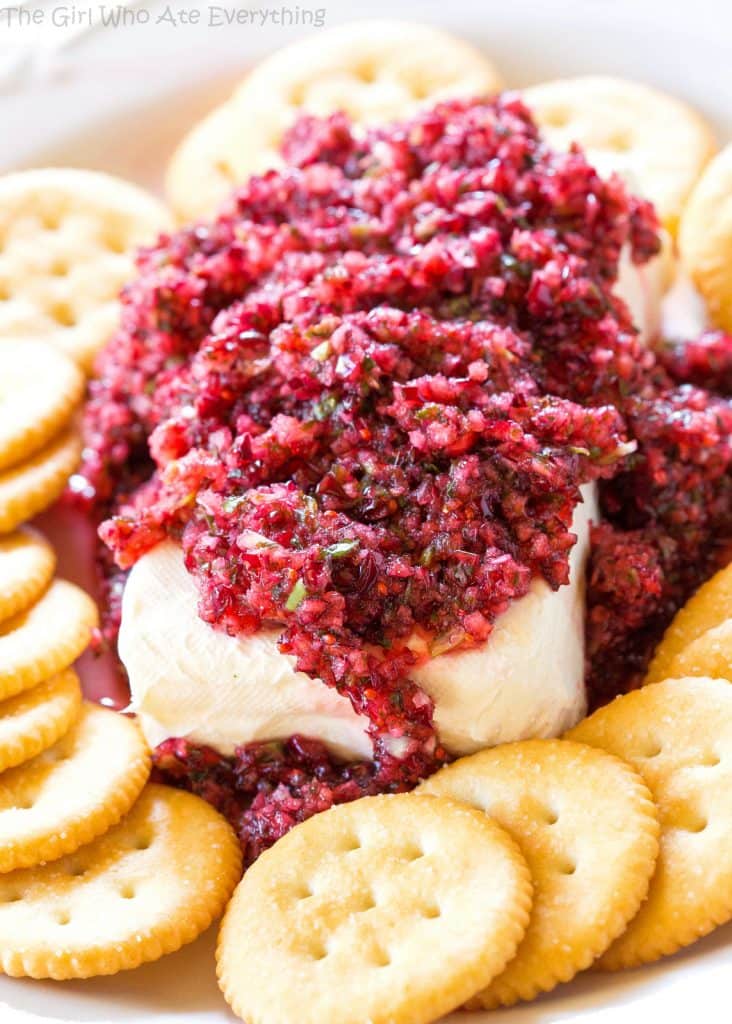 Fresh Cranberry Salsa served over cream cheese - this spicy and sweet combo is always a hit at parties. the-girl-who-ate-everything.com