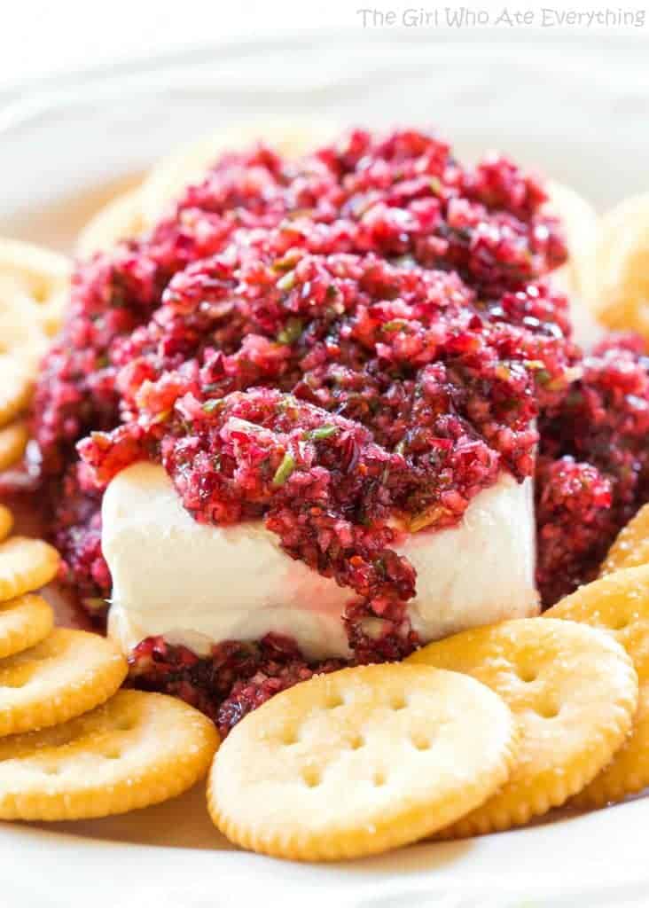 Fresh Cranberry Salsa served over cream cheese - this spicy and sweet combo is always a hit at parties. the-girl-who-ate-everything.com