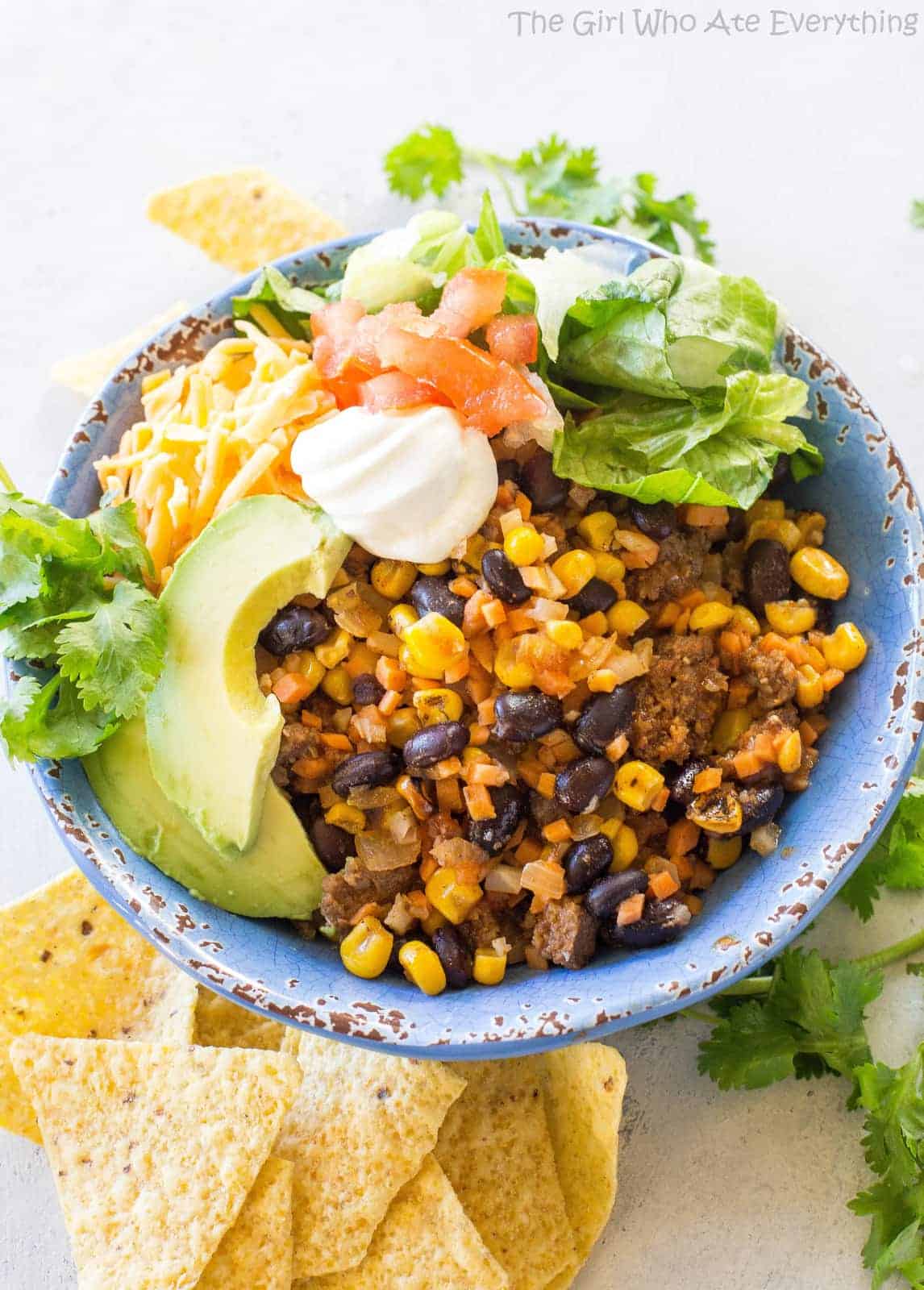 Riced Cauliflower and Sweet Potato Beef Burrito Bowls - a healthy version of your favorite burrito bowl! the-girl-who-ate-everything.com
