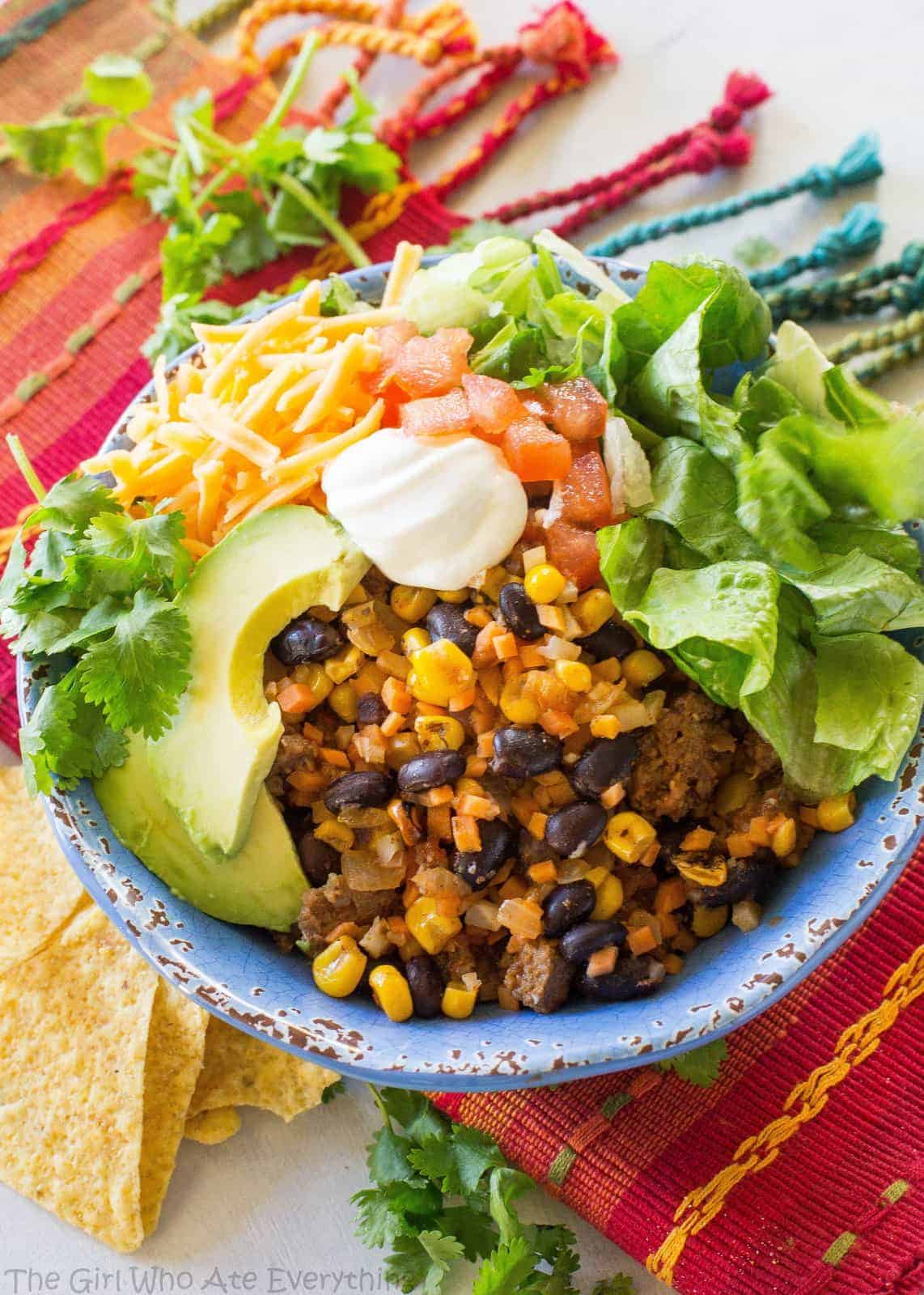 Riced Cauliflower and Sweet Potato Beef Burrito Bowls - a healthy version of your favorite burrito bowl! the-girl-who-ate-everything.com