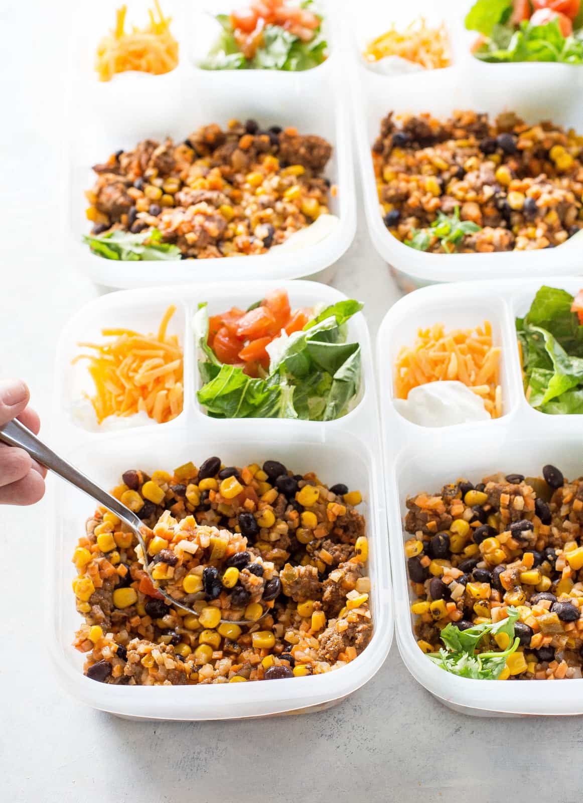 Riced Cauliflower and Sweet Potato Beef Burrito Bowls - a healthy version of your favorite burrito bowl! the-girl-who-ate-everything.com