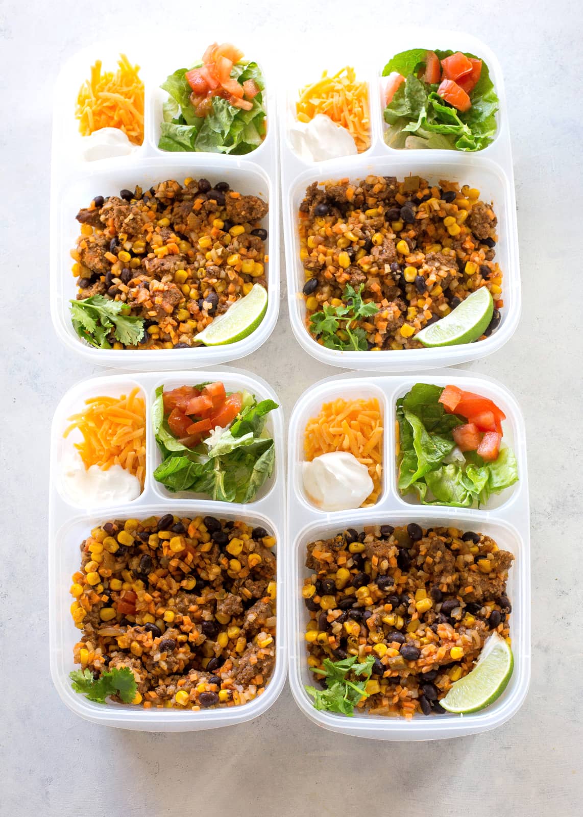Riced Cauliflower and Sweet Potato Beef Burrito Bowls - a healthy version of your favorite burrito bowl! the-girl-who-ate-everything.com