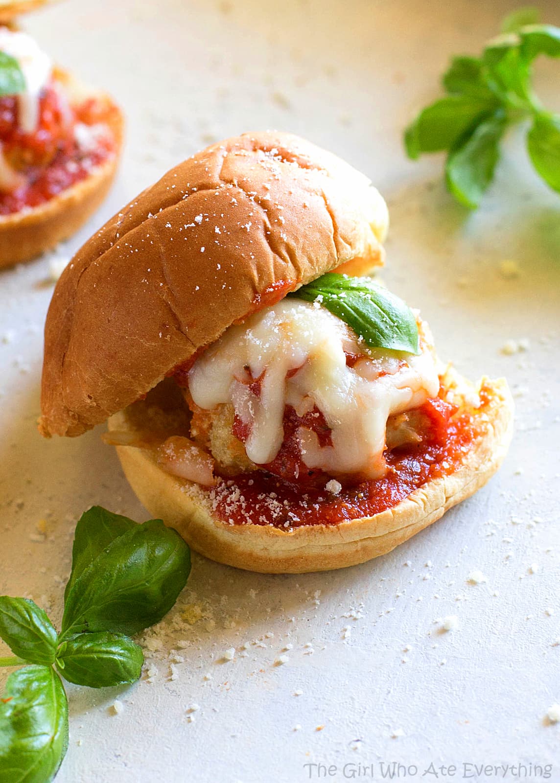 Chicken Parmesan Meatball Sliders - so easy and always a crowd pleaser. You can serve them as appetizers or dinner like I usually do! the-girl-who-ate-everything.com