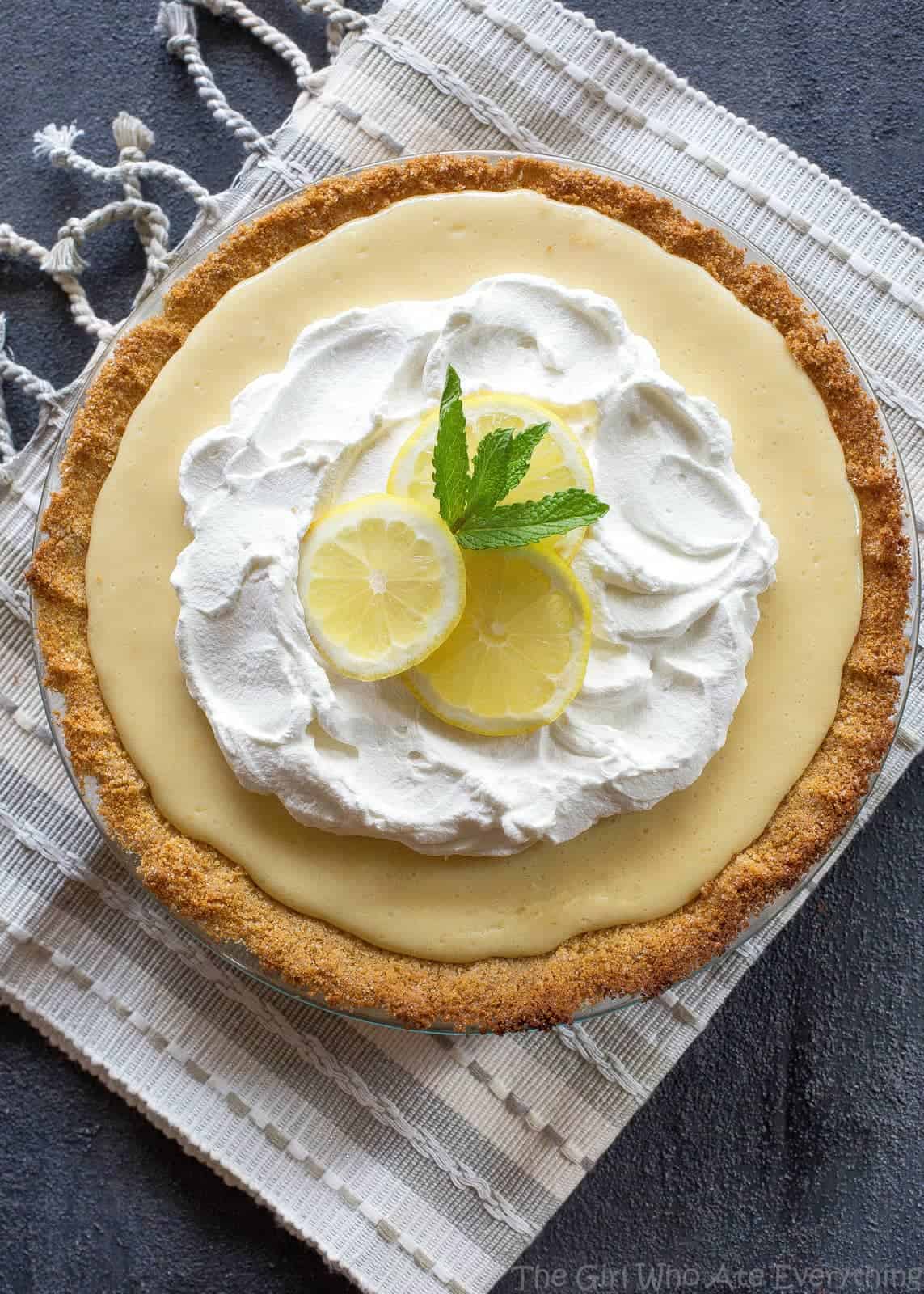 Magnolia's Lemon Pie - light, sweet and tart lemon pie with a thick graham cracker crust. From Joanna Gaines! the-girl-who-ate-everything.com