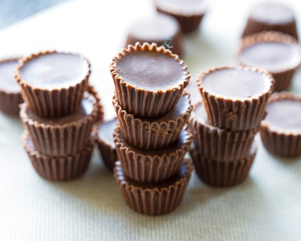 Reese's Peanut Butter Cupcakes - stuffed with Reese's Peanut Butter Cups and topped with a peanut butter frosting. the-girl-who-ate-everything.com