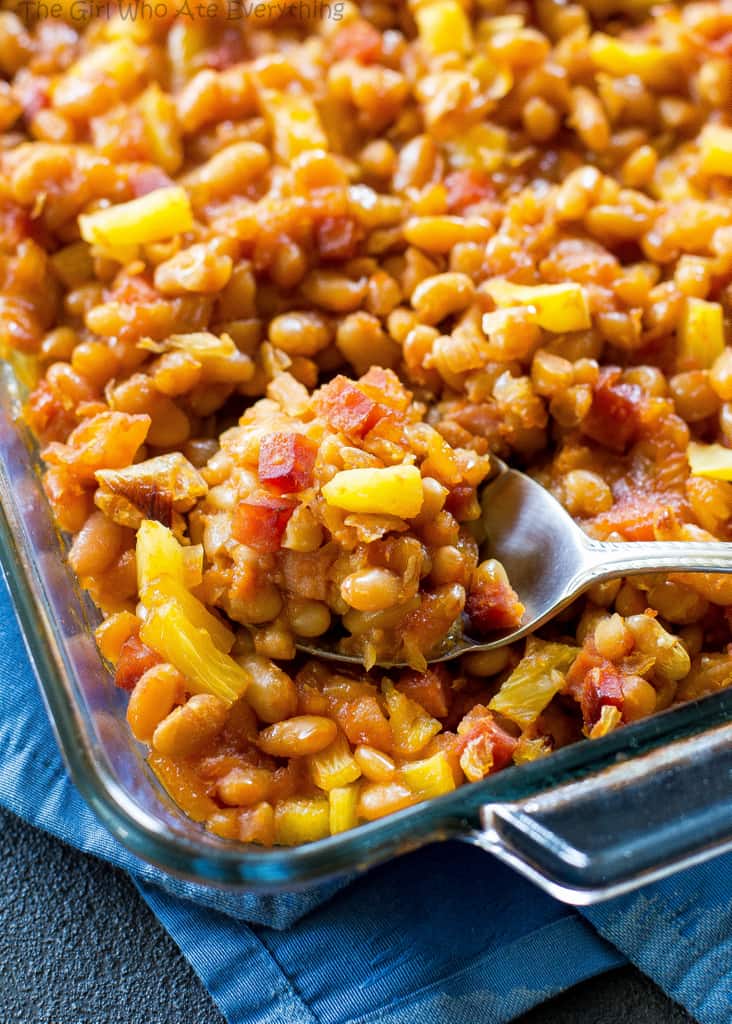 Hawaiian Baked Beans - sweet and salty with bits of ham throughout!. A great side for luaus or BBQs. the-girl-who-ate-everything.com