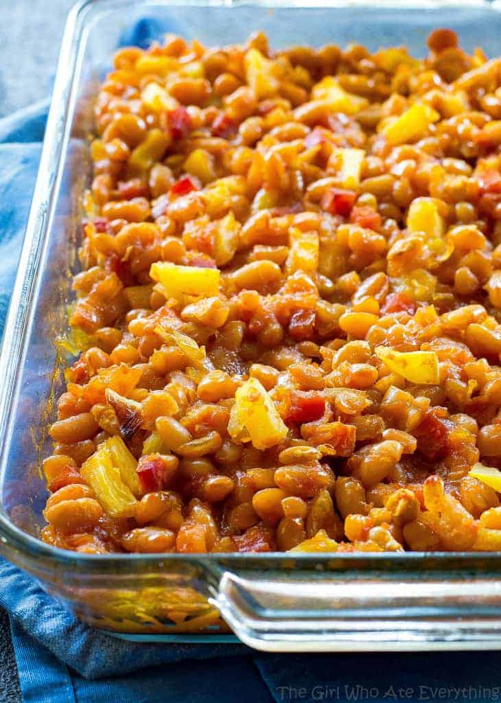 Hawaiian Baked Beans - sweet and salty with bits of ham throughout!. A great side for luaus or BBQs. the-girl-who-ate-everything.com