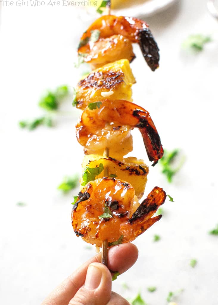 These Grilled Shrimp and Pineapple Skewers are served over coconut rice and have a sweet Teriyaki glaze. the-girl-who-ate-everything.com