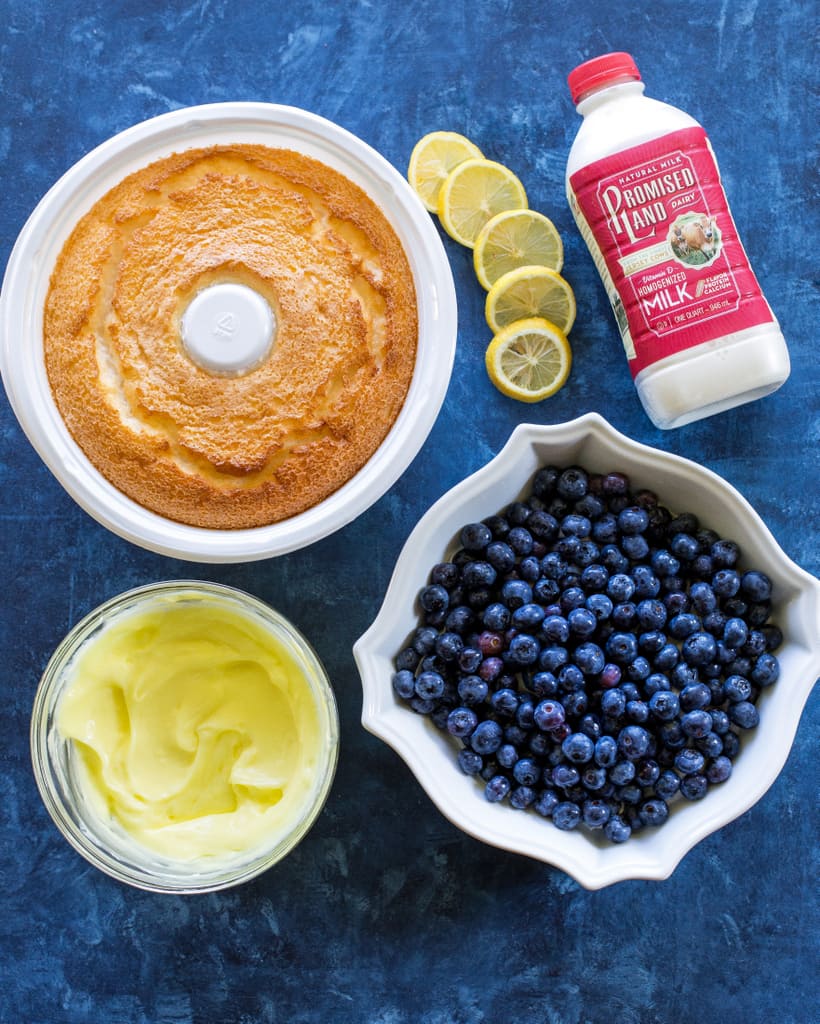 This Lemon Blueberry Trifle is layers of angel food cake, lemon pudding, and blueberries. A crowd pleasing dessert! the-girl-who-ate-everything.com