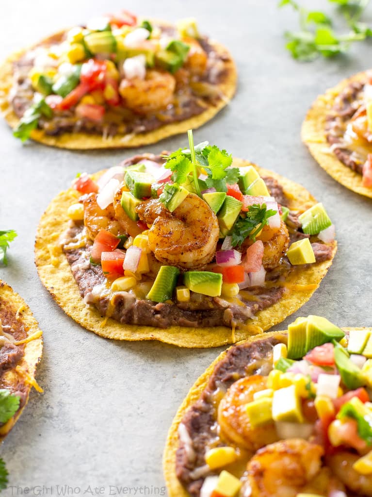 Shrimp Tostadas with black beans, avocado, onions, tomatoes, and cilantro. the-girl-who-ate-everything.com