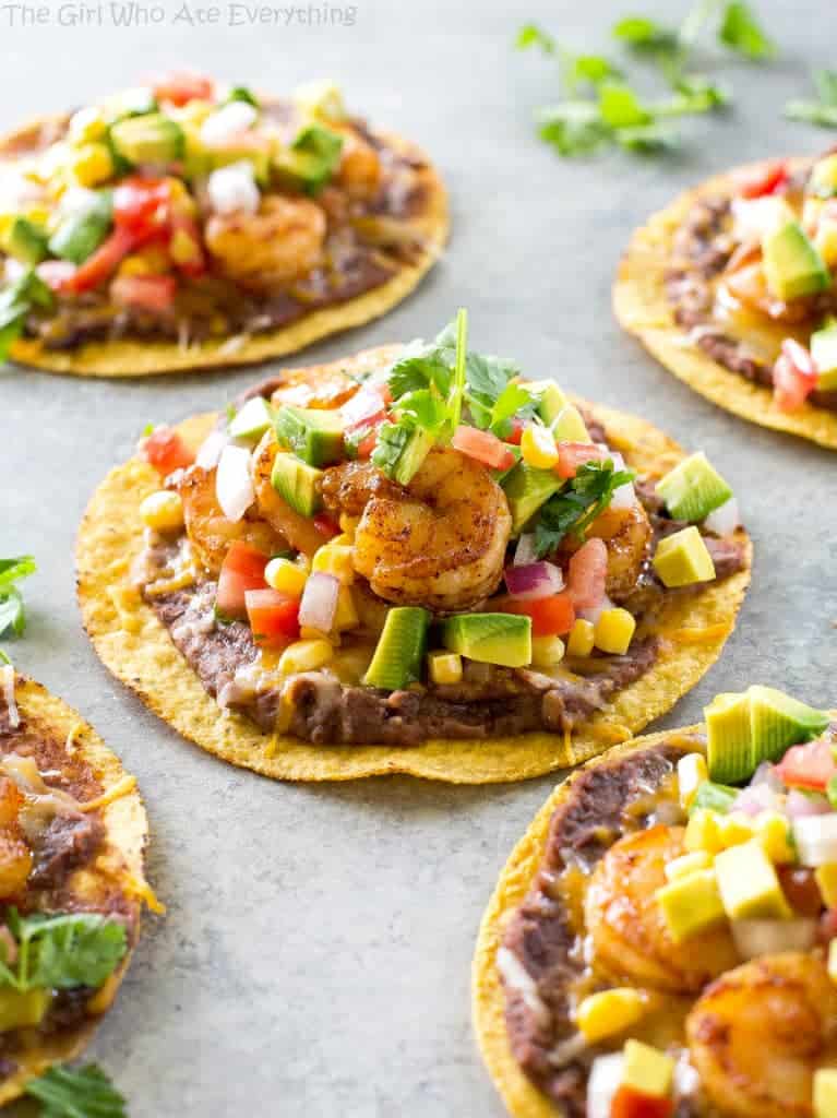Shrimp Tostadas with black beans, avocado, onions, tomatoes, and cilantro. the-girl-who-ate-everything.com