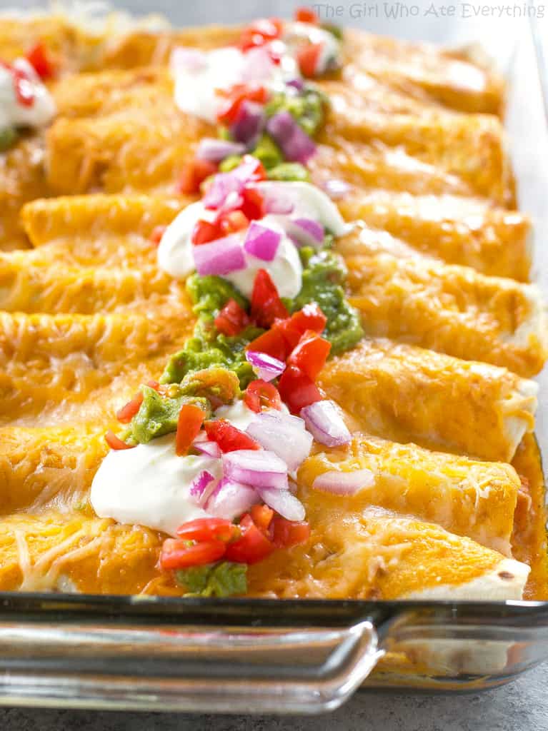 Sweet Potato and Black Bean Enchiladas - a vegetarian Mexican dinner that has the perfect amount of spice and flavor. This is a great freezer meal! the-girl-who-ate-everything.com