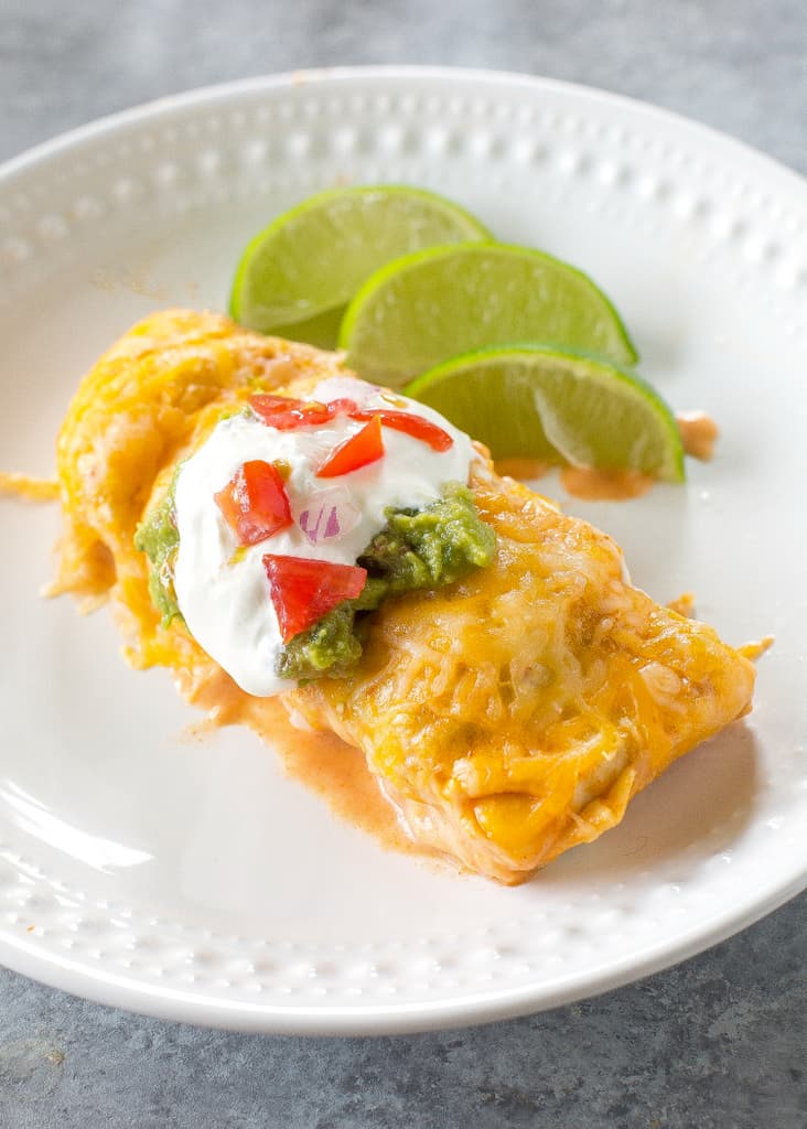 Sweet Potato and Black Bean Enchiladas - a vegetarian Mexican dinner that has the perfect amount of spice and flavor. This is a great freezer meal! the-girl-who-ate-everything.com