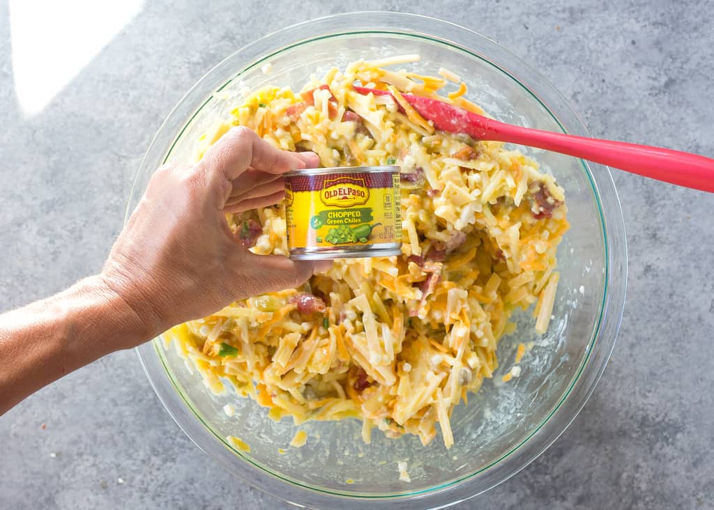 Confetti Bacon Hashbrown Casserole - a great breakfast for entertaining filled with cheesy hash browns, eggs, chiles, green onions, and red bell pepper. the-girl-who-ate-everything.com