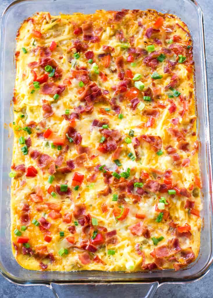 Confetti Bacon Hashbrown Casserole - a great breakfast for entertaining filled with cheesy hash browns, eggs, chiles, green onions, and red bell pepper. the-girl-who-ate-everything.com