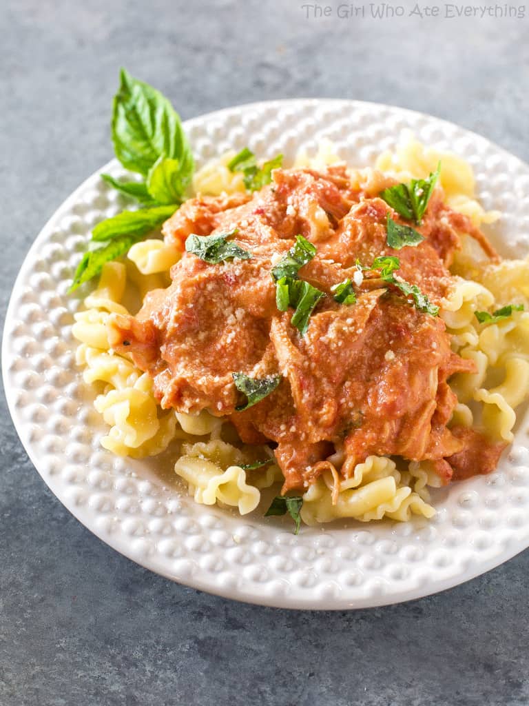 Creamy Tomato Basil Chicken - made in the slow cooker and served over pasta for an easy weeknight dinner. the-girl-who-ate-everything.com