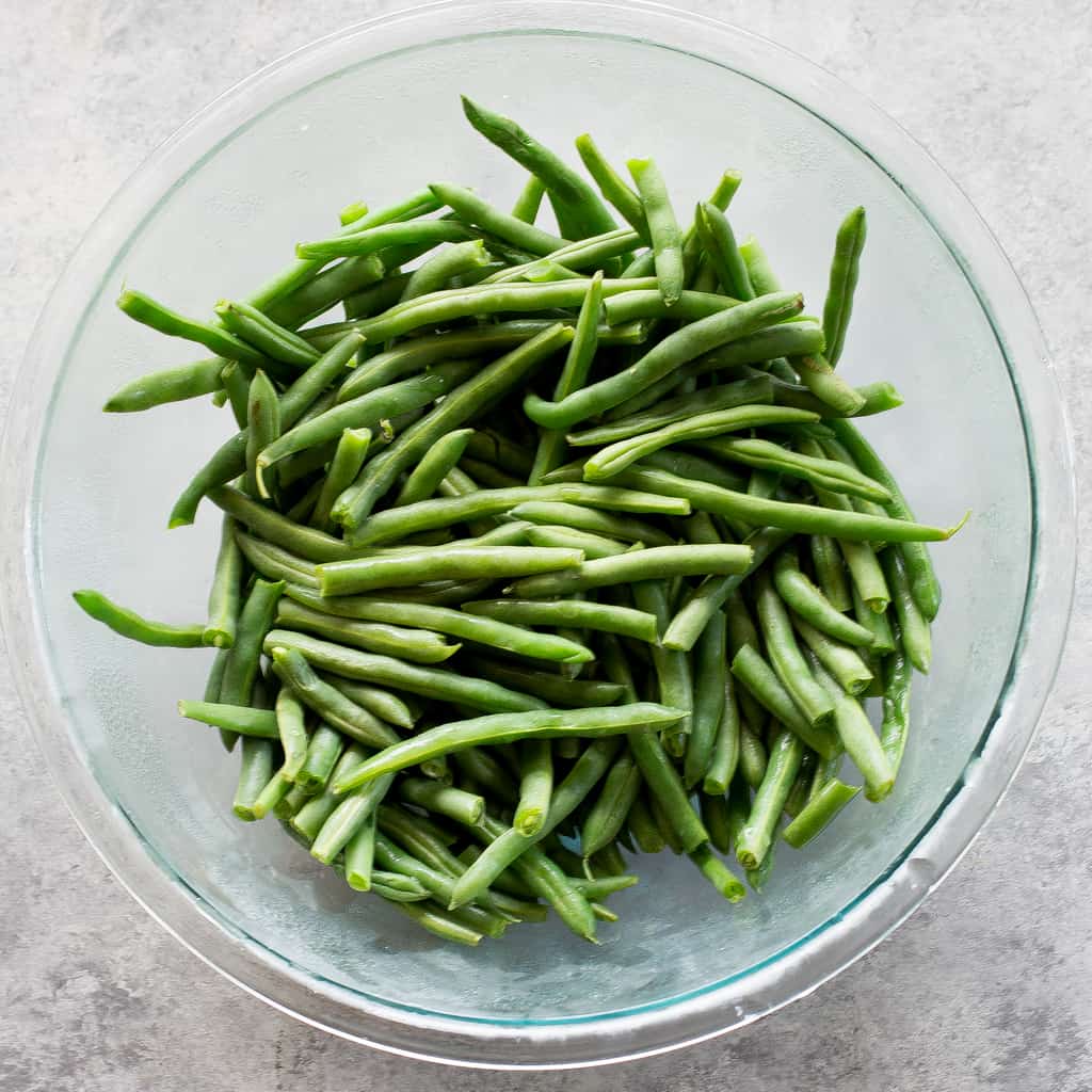 This homemade Green Bean Casserole recipe made without cream of mushroom soup. Easy and delicious side for Thanksgiving or any other holiday. the-girl-who-ate-everything.com