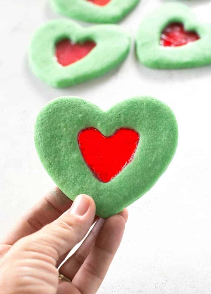 These Grinch Heart Cookies are magical little treats that you can make at Christmas with your kids. the-girl-who-ate-everything.com