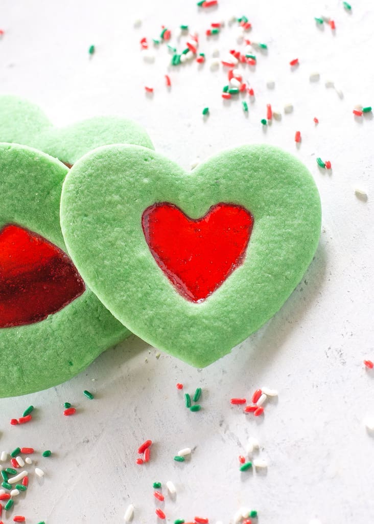 These Grinch Heart Cookies are magical little treats that you can make at Christmas with your kids. the-girl-who-ate-everything.com