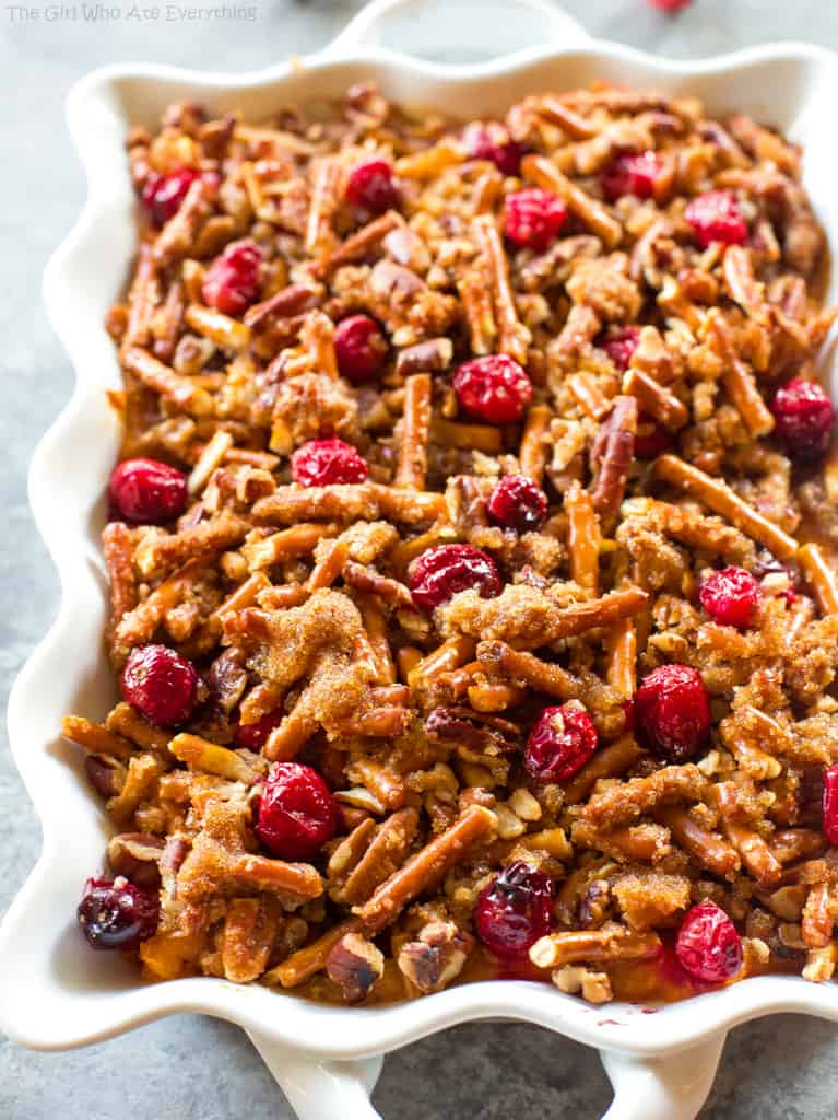 Pretzel Cranberry Sweet Potatoes - sweet potatoes topped with a sweet brown sugar pretzel topping and tart cranberries.