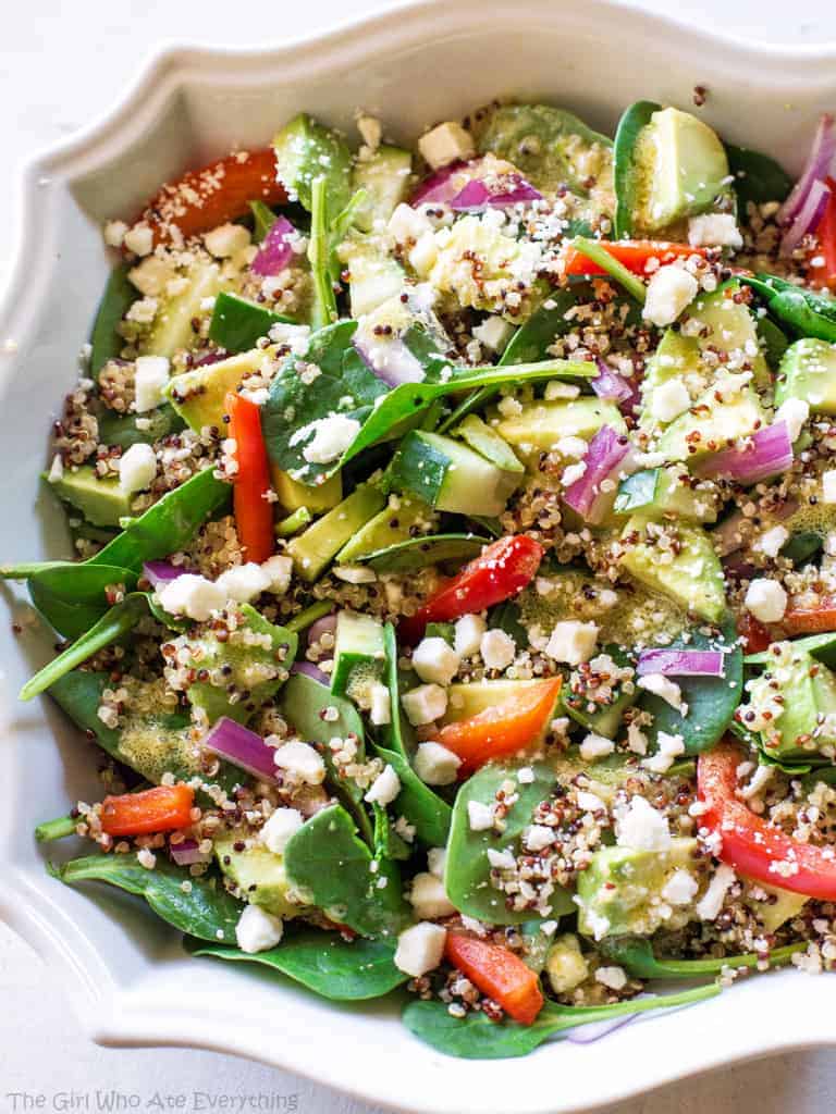 Spinach Quinoa Salad with red bell pepper, avocado, cucumber, onion, and feta