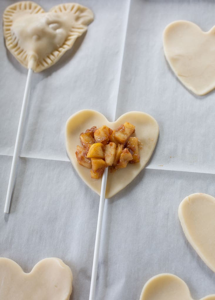 Apple Pie Pops with powdered sugar glaze and sprinkles