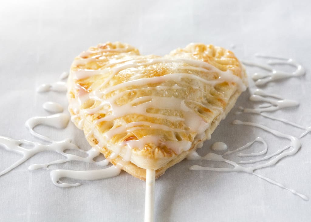 Apple Pie Pops with powdered sugar glaze and sprinkles