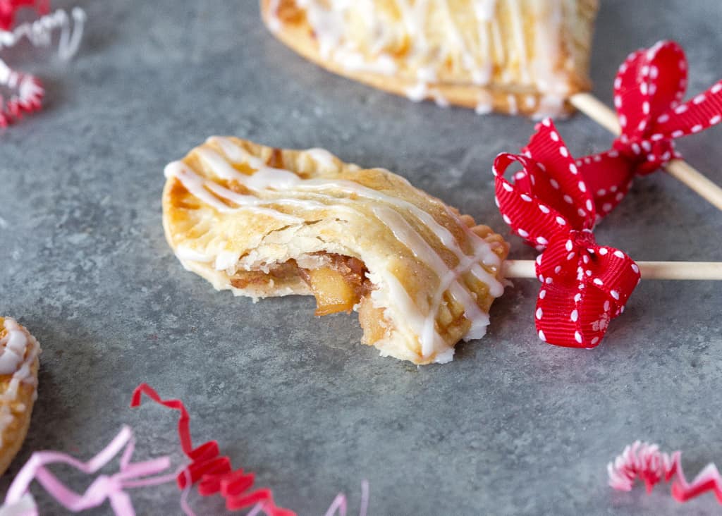 Apple Pie Pops with powdered sugar glaze and sprinkles