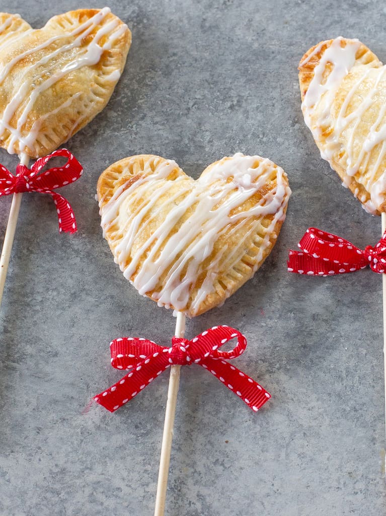 Apple Pie Pops with powdered sugar glaze and sprinkles