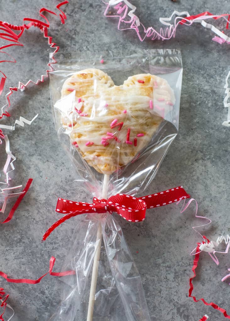 Apple Pie Pops with powdered sugar glaze and sprinkles