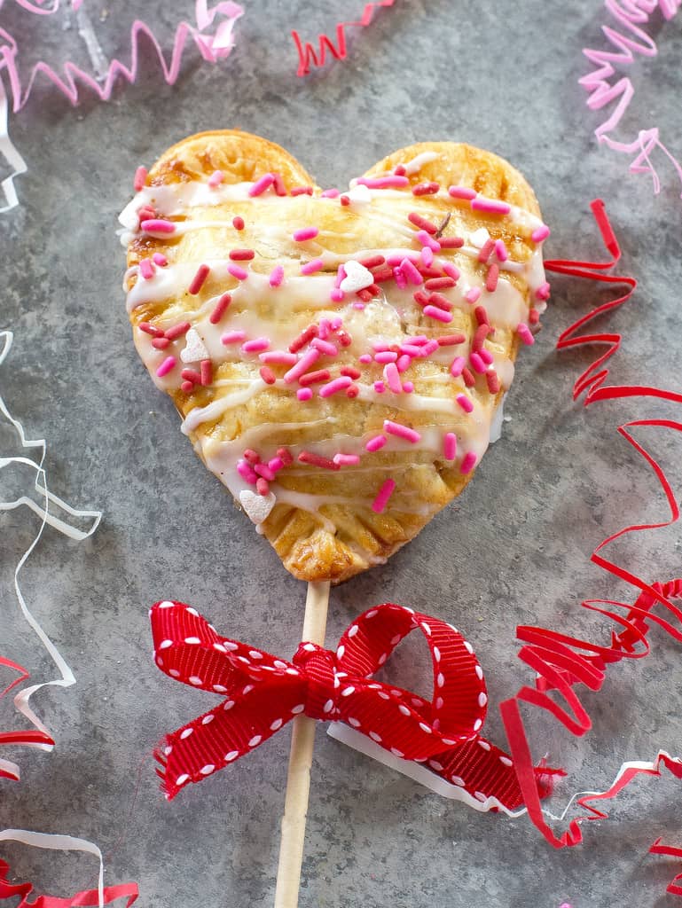 Apple Pie Pops with powdered sugar glaze and sprinkles