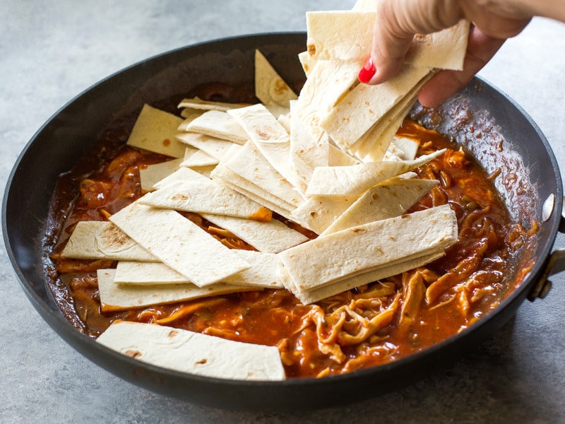 One Pan Chicken Enchilada Skillet enchilada sauce, chicken, tortillas, and salsa