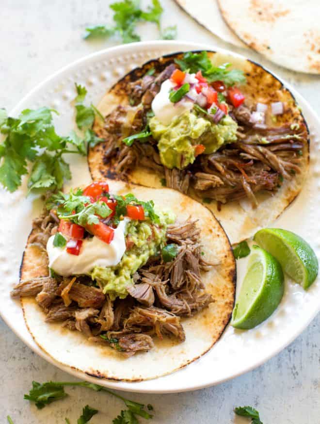 carnitas with sour cream and guacamole