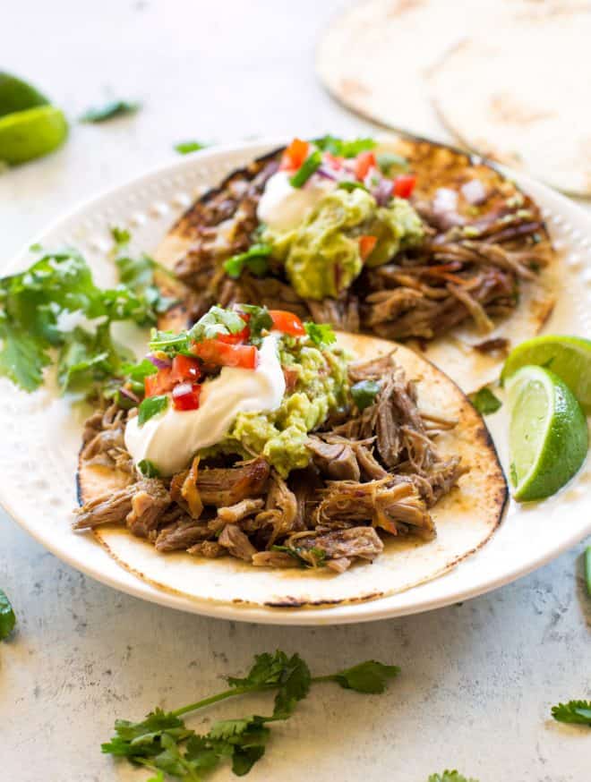 carnitas with sour cream and guacamole